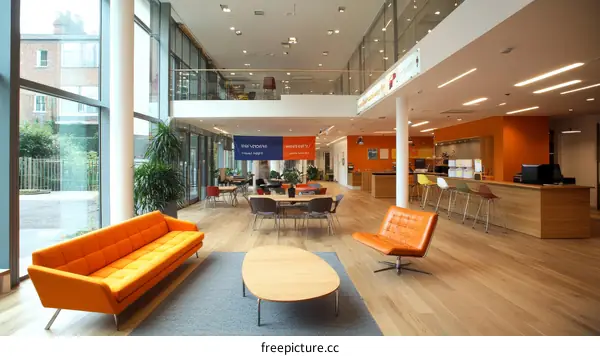 Modern Open-Plan Office Space with Orange Accents