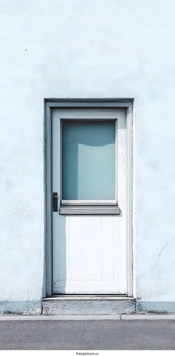 White Door with Glass Window on Blue Wall