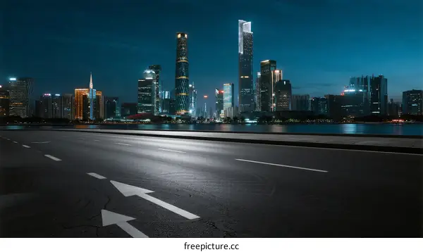 City night view with empty road and modern skyscrapers