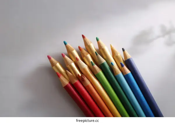 Colorful Pencils Arranged on a White Background