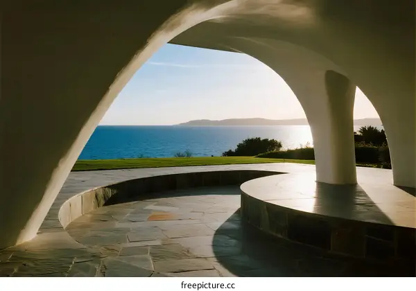 Arched structure with sea view providing serene outdoor space