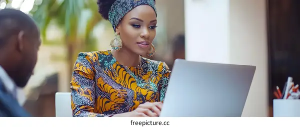 African Woman Working on Laptop in Office