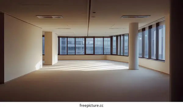 Empty Modern Office Space With City View Windows
