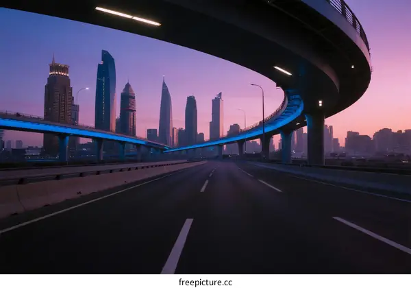 Modern city highway with elevated bridges at sunset