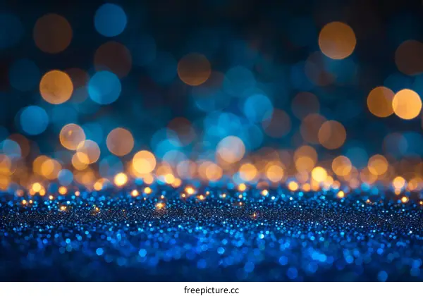 Blue and gold glitter texture with blurred lights background