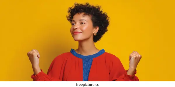 Woman in Red Dress Celebrating Success