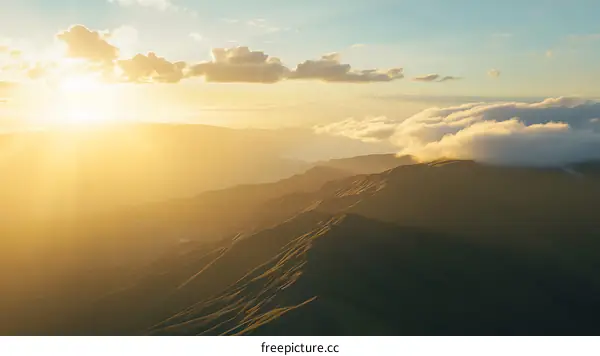 Sunrise Over Mountains in Golden Light