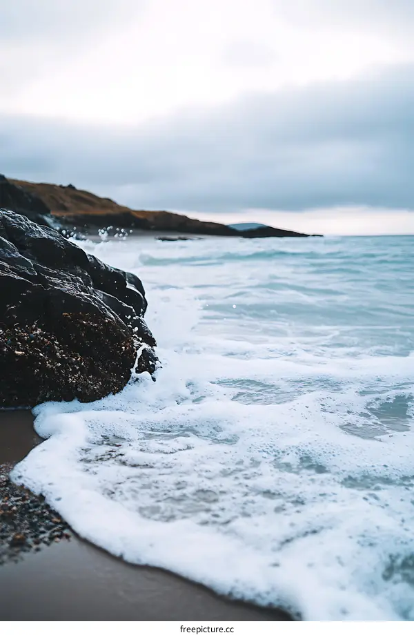 Ocean Waves Crashing On Sandy Beach