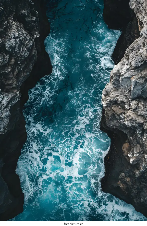 Aerial View of Ocean Water Between Two Cliff Sides