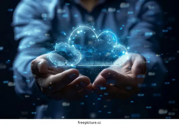 Businessman holding a glowing cloud in his hands