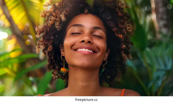Woman Smiling with Eyes Closed in Nature