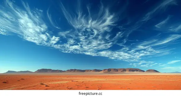 Cirrus Clouds Over Arid Desert Landscape
