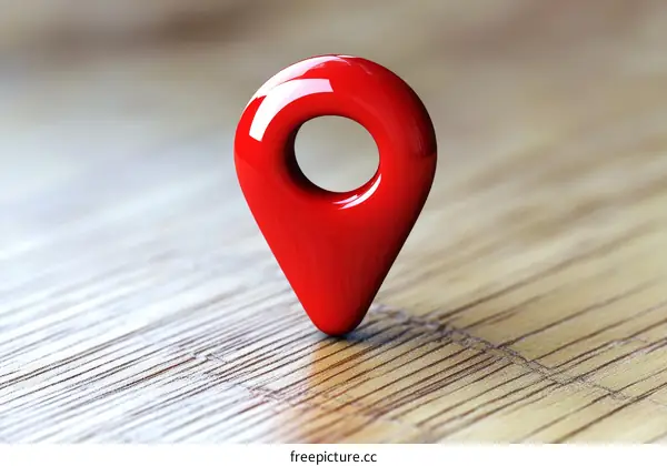 Red Location Marker on Wooden Background