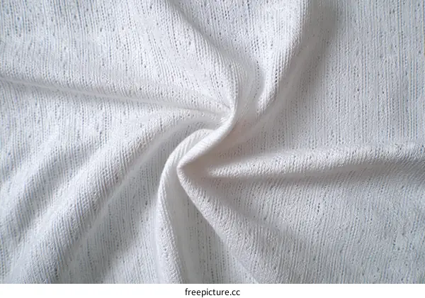Closeup of White Knitted Fabric Texture