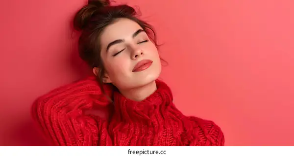 Young Woman Wearing Red Sweater and Posing with Closed Eyes
