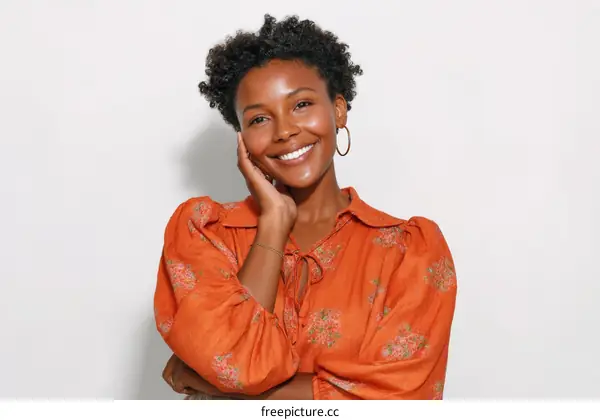 Smiling Woman in an Orange Floral Dress