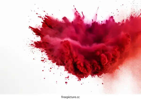 Red powder explosion on white background