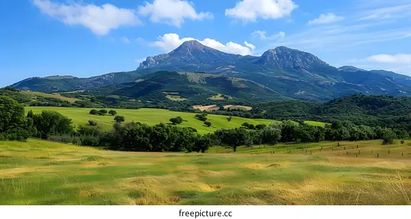 Green Hills and Mountains in the Distance