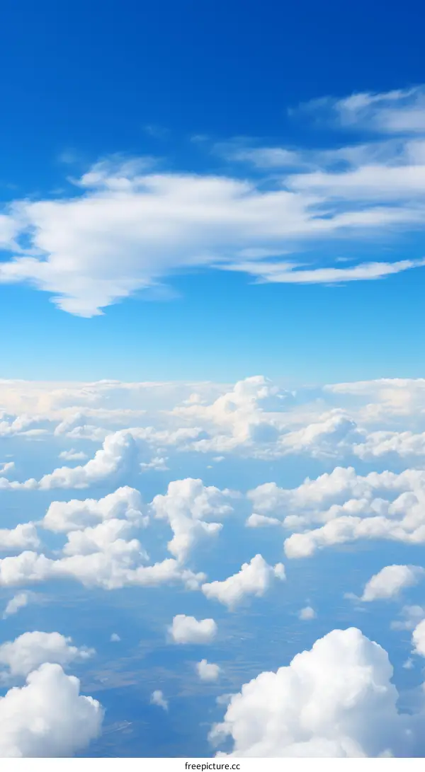 Blue sky and clouds from airplane window