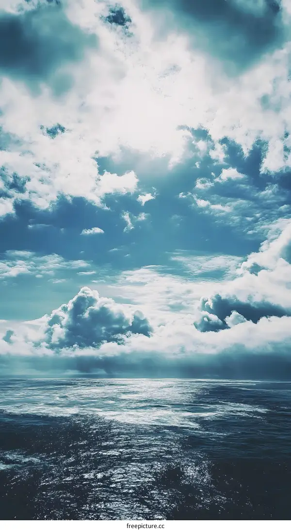 Blue Sky and Ocean with White Clouds