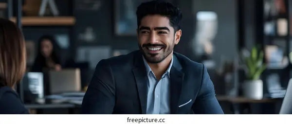 Smiling Businessman in Office Meeting