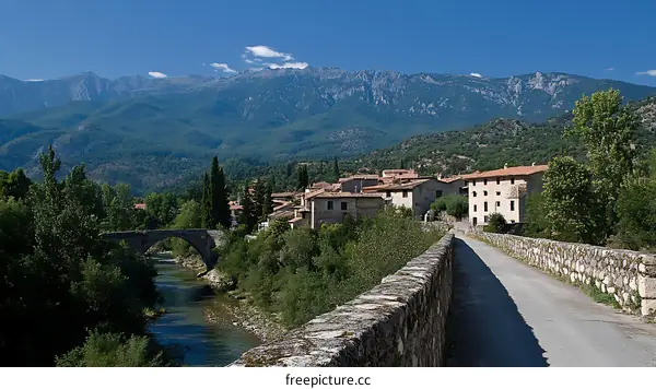 Picturesque Mountain Village with Stone Bridge