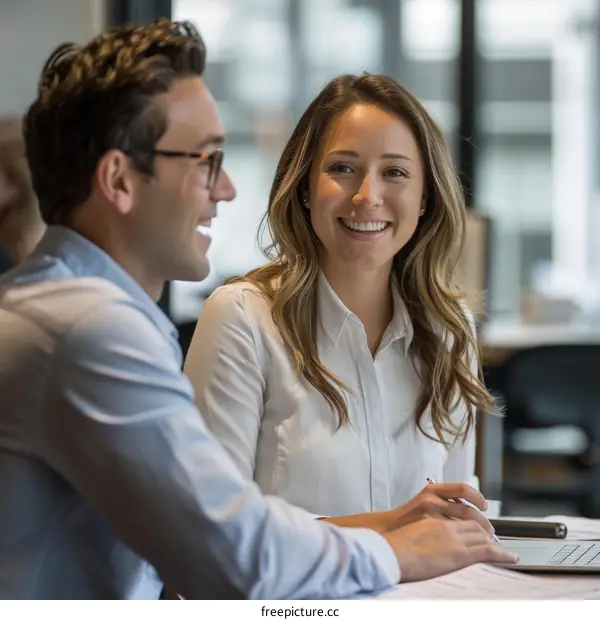 Colleagues discussing ideas in a collaborative work environment