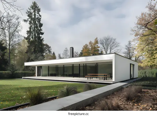 Modern White House With Large Windows and a Patio