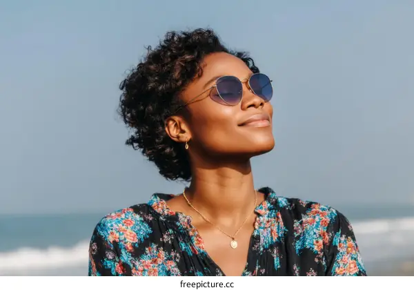 Woman enjoying the sunshine by the beach