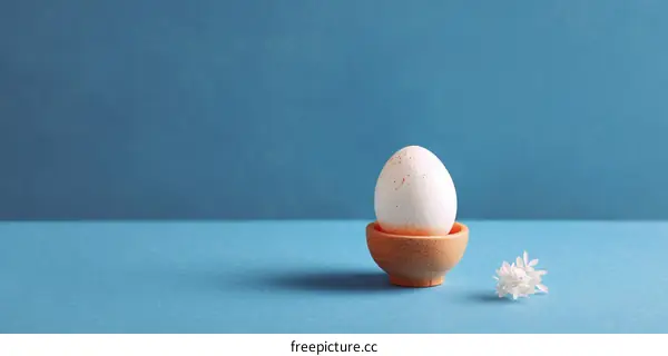 Simple Easter Egg Display on Blue Background