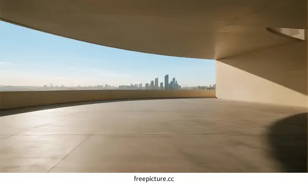 Curved Concrete Structure Overlooking Urban Skyline