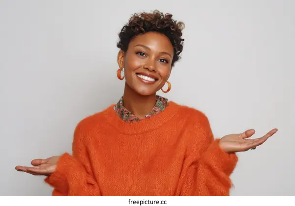 Happy Woman Presenting Fashionable Orange Sweater
