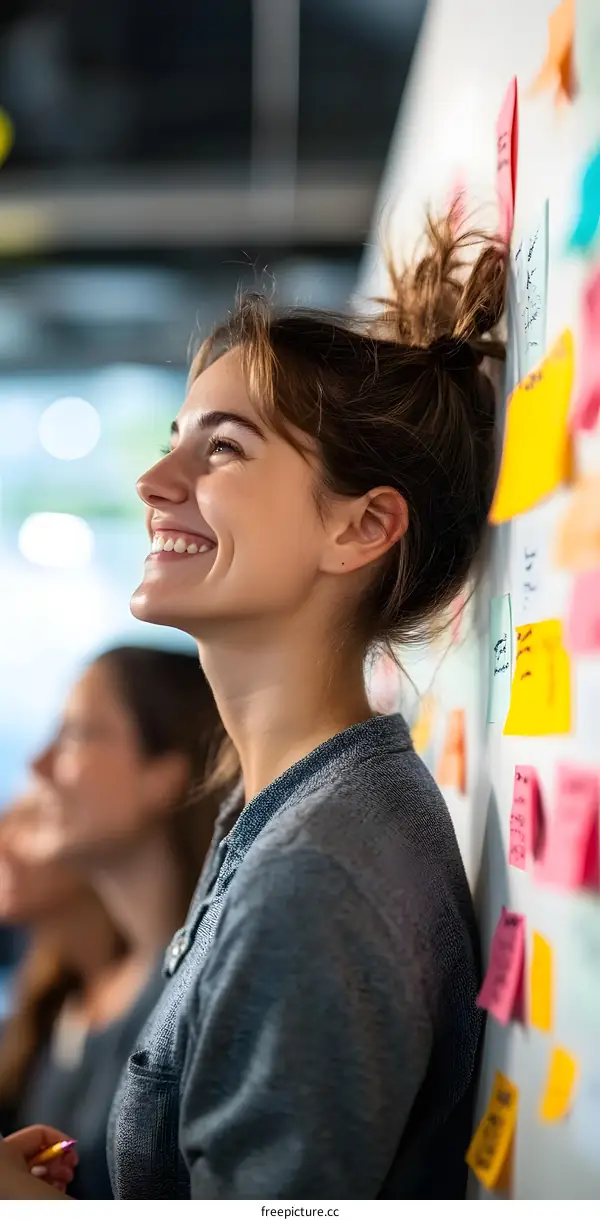 Smiling Woman Leaning Against Whiteboard With Colorful Sticky Notes