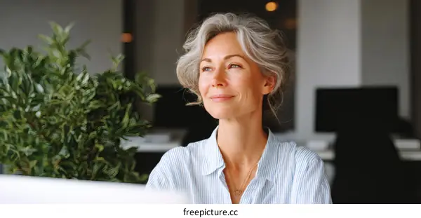 Thoughtful Mature Woman in Office Environment
