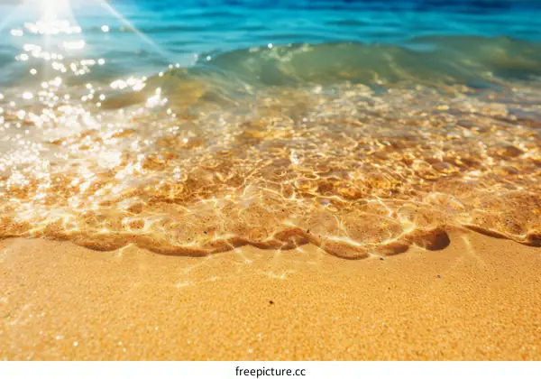 sandy beach with crystal clear ocean water