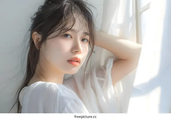 Beautiful Asian Woman Portrait in White Shirt Looking at Camera