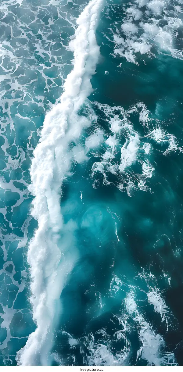 Aerial View of Ocean Waves Breaking