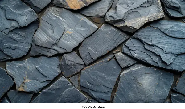 Dark gray slate stone wall texture background