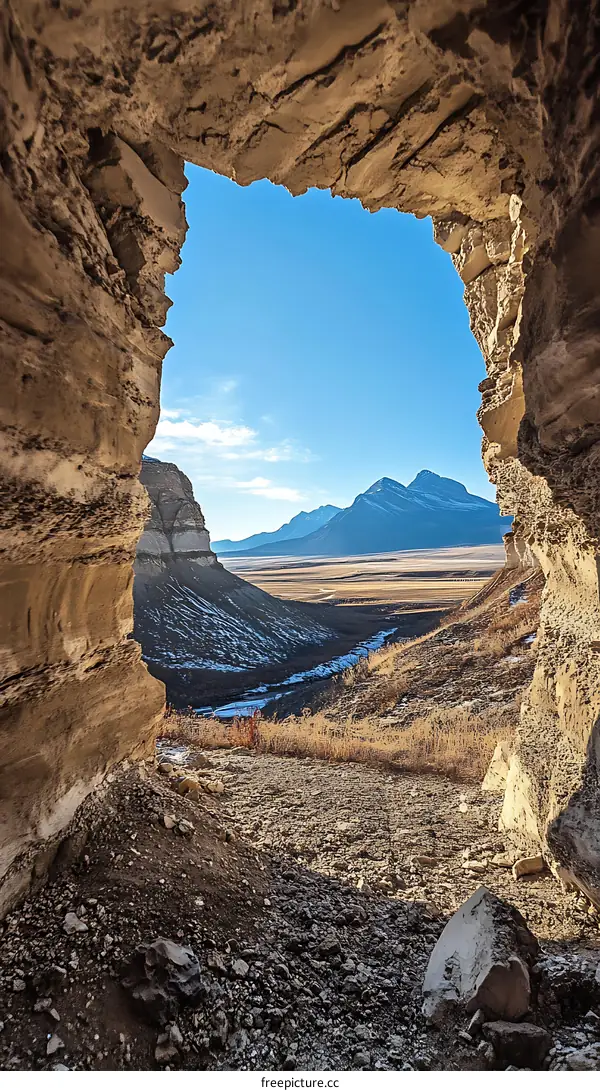 Mountain View Through A Cave Opening