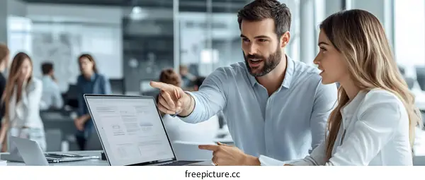 Business People Working on Laptop in Modern Office