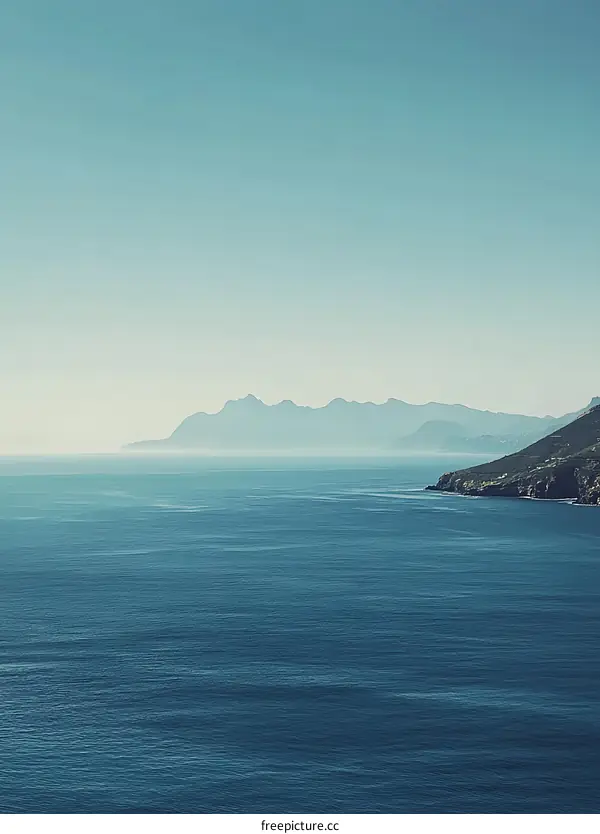 Mountain Range in Distance Over Ocean Water