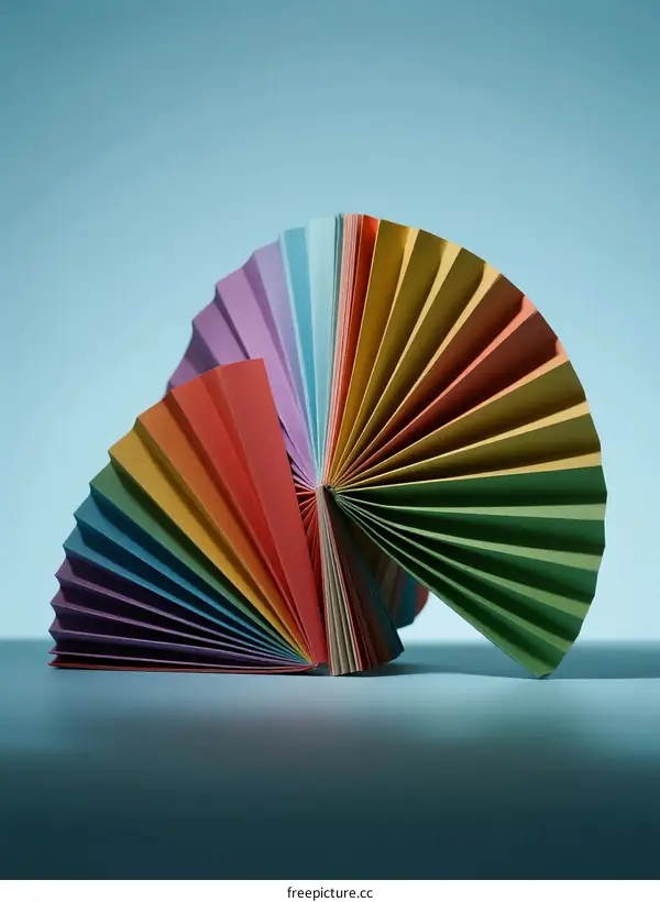 Colorful Paper Fan Art with Vibrant Folds and Symmetrical Design