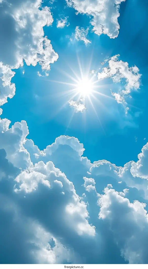 Blue sky with white clouds and shining sun
