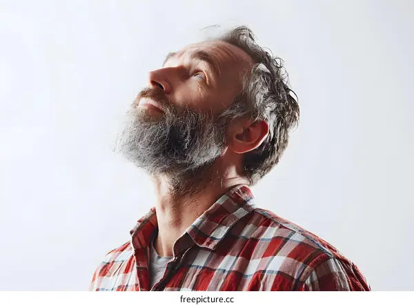Bearded man looking up