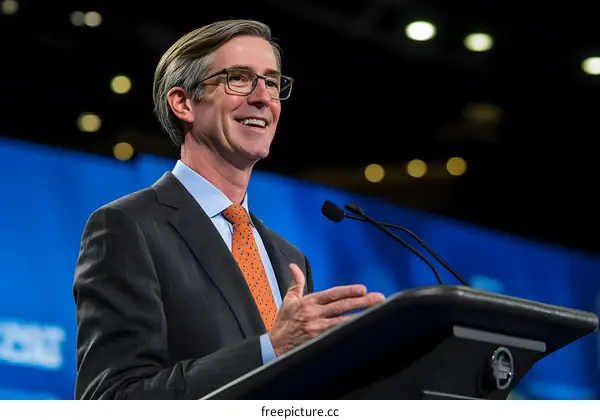 Man in Suit Giving a Speech at a Podium