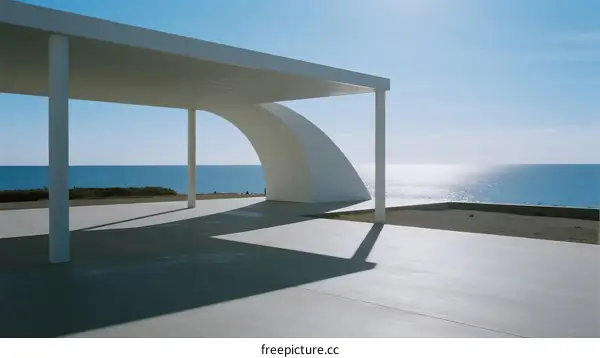 Minimalist White Pavilion Overlooking Calm Blue Ocean