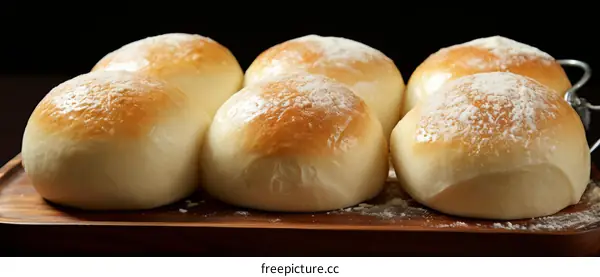 Close-up of a variety of bread rolls on a wooden board