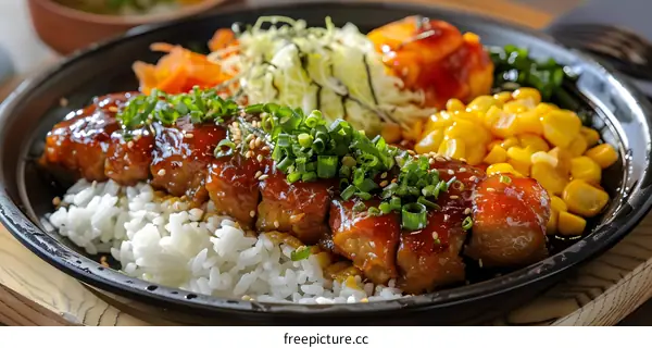 A delicious Japanese dish with rice, meat, and vegetables