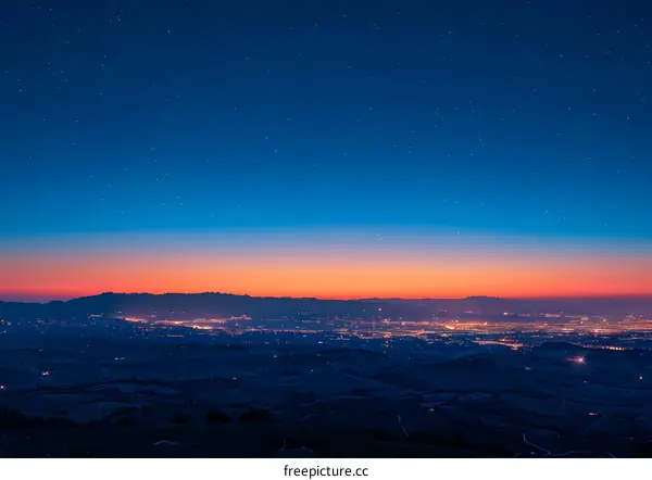 Night Sky Over City Lights