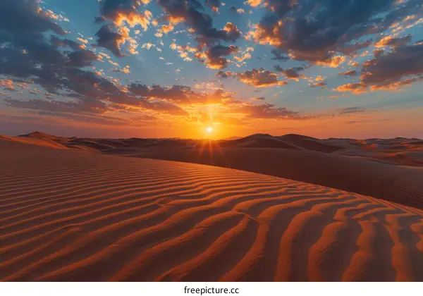 Amazing sunset over the sand dunes in the middle of the desert